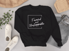The Favoured & Unstoppable Sweatshirt by AfroBold featuring bold text design, crafted with premium fabric for comfort and cultural pride in modern style.